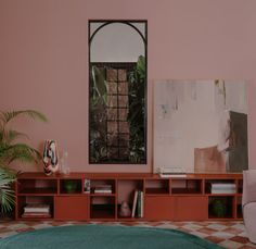 a living room with pink walls and furniture