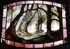 a stained glass window with trees in the woods on it's sides and pink trim