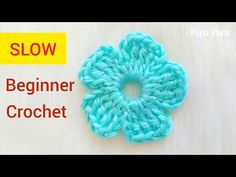 a crochet flower is shown with the text slow