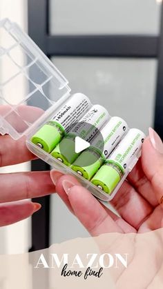 a person holding some green batteries in their hand with the caption amazon home find