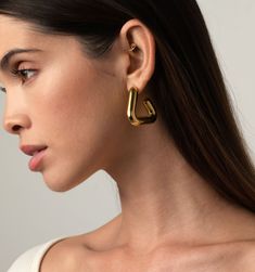 Meet these gorgeous Triple Hoop Earrings - they're light as air and super versatile! They are a fun spin to the traditional circle hoops. The modern triangle shape complements all face shapes. These hoops are waterproof and tarnish-resistant. They're your new go-to earrings!
Size:1.25" Modern Triangle Gold Hoop Earrings, Football Necklace, Football Bracelet, Triple Hoop Earrings, Droplet Earrings, All Face Shapes, Gold Triangle, Fashion Landscape, Long Drop Earrings