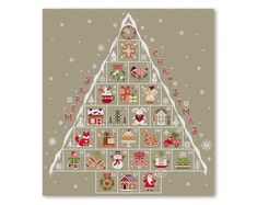 a cross stitch christmas tree with presents on it