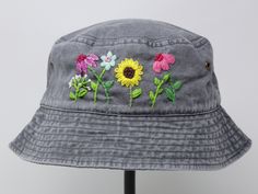 Item: mushroom embroidered bucket hat Material: 100% cotton Size: one size fits most Embroidery: hand made with acrylic thread Free first class shipping, upgradable priority mail service. 30 days return policy, feel confident at your purchase! Casual Cotton Sun Hat With Embroidery, Casual Embroidered Adjustable Bucket Hat, Casual Embroidered Cotton Bucket Hat, Adjustable Embroidered Cotton Sun Hat, Casual Embroidered Bucket Hat For Beach, Adjustable Embroidered Cotton Bucket Hat, Embroidered Adjustable Bucket Hat, Spring Bucket Hat With Embroidered Logo, Adjustable Embroidered Bucket Hat