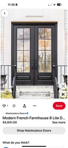 the front door is black and has two glass doors