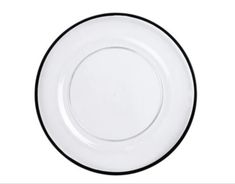 an empty white plate with black trim on the rim is shown in front of a white background