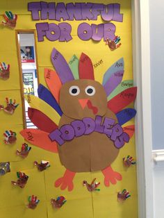 a door decorated with handprints and a turkey