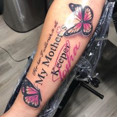 a woman's arm with two butterflies and the words i love my mother on it