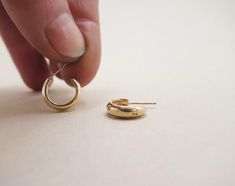 Our smallest Villa Hoop style. A classic shape, with subtle angles and an understated size that gently hugs the earlobe. A perfect every day staple. Our brass and sterling silver Villas have sterling posts and backings, our gold vermeil have 14k gold fill backings and our recycled solid 14k gold Villas have 14k gold posts and backings Hoops are approximately 1/2” in diameter Minimalist Oval Huggie Earrings For Anniversary, Everyday Rounded Earrings With Polished Finish, Minimalist Rounded Earrings For Gift, Minimalist Rounded Earrings For Gifts, Everyday Polished Rounded Earrings, Everyday Rounded Polished Earrings, Minimalist Oval Huggie Earrings For Everyday, Small Minimalist Earrings For Everyday, Small Villa