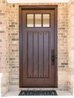 the front door is made of wood and glass