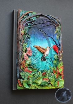 a book with an image of a hummingbird in the forest on it's cover