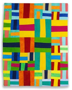 an art quilt with multicolored squares and lines on the front, in various colors