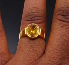 Traditional style handmade 22karat yellow gold gorgeous colorl stone handmade tribal ring band jewelry from rajasthan india. weight- 7.190 grams approx. width-11 mm maximum. metal-yellow gold. metal purity- 22 karat. brand-handmade. Stone-sunela stone(citrine)  marking- 916 stamp. size-select size. weight of ring may be increase or decrease according to size. note-gold jewelry is handmade designer jewelry . so there can be slight difference in size and weight of the article in the comparison of Gold Ring With Bezel Setting, Gold Fusion Style Ring Jewelry, Yellow 22k Gold Jewelry For Wedding, Yellow 22k Gold Wedding Jewelry, Yellow Gold Kundan Round Jewelry, Fine Jewelry With Prong Setting In Yellow Sapphire, Yellow Gold Kundan Jewelry, Gold Bezel Set Ring, Round Kundan Yellow Gold Jewelry