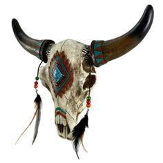 an animal skull with long horns and feathers on it's head, decorated with beads