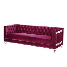 a purple couch with chrome legs and buttons on the back, sitting in front of a white background