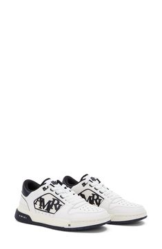 AMIRI adds a new sneaker to their lineup with this low-top style that features a rubberized logo detailing the mesh side wall and tiny star-shaped perforations. Lace-up style Leather and synthetic upper/textile and leather lining/synthetic sole Imported Designer Shoes Sporty Low-top Skate Shoes With Logo Print, Low-top White-sole Skate Shoes With Perforations, White Sole Low-top Skate Shoes With Logo Print, Custom Low-top Sneakers With Perforations And White Sole, Sporty Custom Low-top Sneakers With Perforations, Low-top Perforated Skate Shoes For Sports, Sporty Skate Shoes With Logo Print And White Sole, Low-top Perforated Sneakers For Streetwear, Low-top Sneakers With Embossed Logo For Streetwear