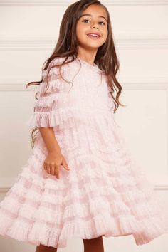 Description & Details NEW SEASON. The La Vie En Rose Kids Dress in Peony Pink / Cream. This beautiful dress is adorned with delicate tulle ruffles, engineered throughout the panels to enhance the silhouette. Crafted with gathered tulle in a contrast colour to the base fabric creates a soft, gentle effect. The perfect dress for all their upcoming special events. - Kisses tulle decorated with layers of tulle ruffles - Bodice and skirt are fully lined, sleeves are unlined - 100% Recycled polyester Children's Dresses, Tulle Ruffles, Full Tulle Skirt, Tulle Material, Gathered Bodice, Peony Pink, Dresses For Girls, Pattern Texture, Needle Thread