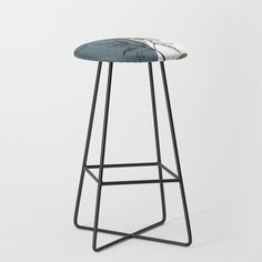 a stool with a multicolored seat and metal frame legs, on a white background