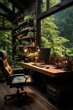 a chair and desk in front of a large window with trees outside the glass wall