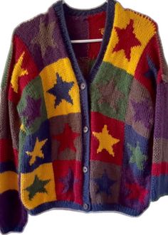 a colorful cardigan sweater with stars on it