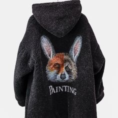 Embodying Doublet’s Philosophy Of Recycling Already-Existing Fur Products, This Oversized Hooded Coat Is Crafted From A Blend Of Recycled Furs, Wool And Nylon. Its Back Features A Large Print Of A Fox, Raccoon, And Rabbit Mix, Representing The Multiple Recycled Furs That Are Part Of The Composition Of This Grand Coat That Flaunts An Open Front And An Interior Lined In Black Branded Cupro. Size: M Condition: Pristine; No Visible Signs Of Wear Approximate Measurements (Laid Flat): Shoulder: 27.5” (70 Cm) Chest: 27.5” (70 Cm) Length Down Back: 32.25” (82 Cm) Sleeve: 20.5” (52 Cm) Composition: Pile: 50% Wool, 34% Nylon, 18% Mix Of Fox, Rabbit And Raccoon; Ground: 100% Polyeste Oversized Hooded Coat, Hooded Coat, Real Fur, Large Prints, Philosophy, Mens Jackets, Recycling, Jackets & Coats, Grey