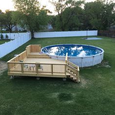 an above ground swimming pool with steps leading up to it