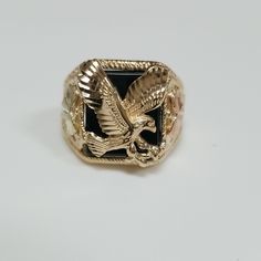 Yellow Gold 10kt Onyx Eagle Ring. Great Gift! Solid 10kt Yellow Gold Stamped And Weighs 7.7 Grams A Size 10 And Can Be Sized For Additional Cost. Thank You For Looking Please Check Back Lots To Come. Gold Onyx Jewelry For Anniversary, Gold Onyx Jewelry For Anniversaries, Luxury Black Hallmarked Jewelry, Luxury Black 14k Stamped Rings, Luxury 14k Black Rings, Eagle Ring, Gold Eagle, Eagle Black, Black Hills Gold