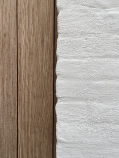 a white piece of paper sitting on top of a wooden door