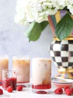 raspberry lemonade punch in glasses with fresh raspberries on the side