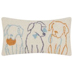 an embroidered pillow with three dogs on it