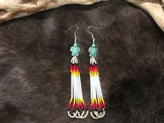 Authentic Beautiful Native American Indian Jewelry Navajo Hand Beaded Long Dangle Earrings. Great for a gift❤️ Handcrafted by Navajo Artist R. Sellers These beautiful earrings are 5" in length and 1" in width. Adjustable Southwestern Beaded Earrings With Ear Wire, Artisan Adjustable Hand-strung Earrings, Southwestern Style White Jewelry With Dangling Beads, Southwestern Dangle Beaded Earrings, Traditional Hand-strung Earrings For Gifts, Southwestern Adjustable Dangling Bead Earrings, Adjustable Southwestern Beaded Earrings, Adjustable Hand-strung Southwestern Beaded Earrings, Indian Jewelry Earrings