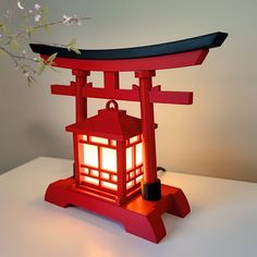 a red lantern sitting on top of a white table