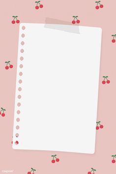 a piece of paper with cherries on it next to a pink wallpaper background