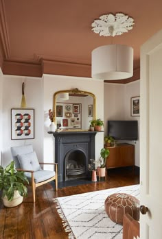 the living room is clean and ready for us to use it's fireplace as a focal point