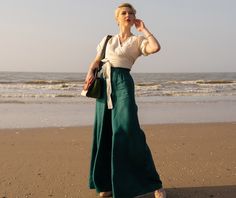 "Emerald Green Linen Pants, Palazzo Pants, Wide Leg Pants ♠ Casual style with extravagant touch and ideal for your provocative nature. The delicately crafted pieces from natural materials will embrace your body in a perfect fit. Dare to be Visible! You can find the set of two - tunic and pants, here: https://etsy.me/2RSBuld ♠ Sizes The model on the picture is 168 cm/5'5\" tall and is wearing size М. Have a look at my Size Chart below to make sure your piece will fit you best. ** Custom Orders For any changes or adjustments you may need, please contact us before making a purchase. The amount of the additional payment depends on the type of customization requested. Please allow additional time for custom sized orders. Please note that we cannot accept returns or exchange for customized items Linen Summer Pants, Plus Size Linen Pants, Linen Pants Plus Size, Green Linen Pants, Summer Linen Pants, Plus Size Linen, Bohemian Pants, Elegant Pant, Pants Linen