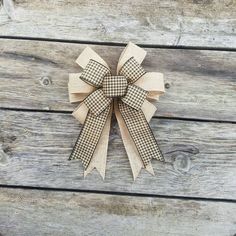 a close up of a bow on a wooden surface