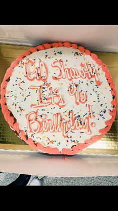 a birthday cake with frosting and sprinkles on it in a box