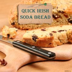 a loaf of bread sitting on top of a wooden cutting board next to a knife