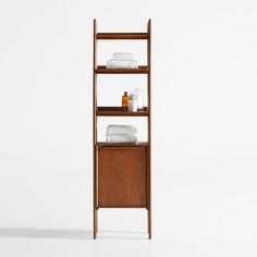 a wooden shelf with towels and other items on it