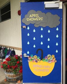 a door decorated to look like an umbrella with raindrops and flowers on it