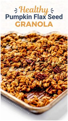 healthy pumpkin flax seed granola in a baking pan with text overlay that reads healthy pumpkin flax seed granola