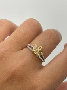 2D Crown Ring  -white CZ stones  -solid yellow gold crown  - available in size 7  -100% solid 14k gold  -will not tarnish, nor change color  -24/7/365 wearable  -sizing upon request. Ring are all final sales. -any questions please let us know  -item is sold by piece. Weight is undetermined. Gold Crown-shaped Diamond Ring, Luxury Gold Rings With Crown Design, Gold Diamond Ring With Crown Design, Luxury Yellow Gold Rings With Crown Design, Gold Cubic Zirconia Crown Ring, Yellow Gold Diamond Crown Ring, Gold Crown Shaped Diamond Ring, Yellow Gold Crown Design Diamond Promise Ring, Yellow Gold Diamond Ring With Crown Design