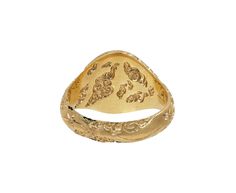 This edgy, hand carved Castro Smith ring has a statement making, eye-catching design. The matte, 9K yellow gold ring shows a tiny sword surrounded by shooting stars set with diamonds and swirling clouds. Engraved on the interior of the 9K yellow gold band are extra swirling clouds.9K yellow gold ring face : just over 1/2" x 1/2"diamonds : 1mm diameter each9K yellow gold band width : 4mmsize available : 10please contact us for sizing options Luxury Carved Yellow Gold Signet Ring, Unique Yellow Gold Engraved Ring, Unique Engraved Yellow Gold Ring, Diamond Intaglio Rings, Fine Jewelry, Diamond Intaglio Fine Jewelry Rings, Unique Engraved Yellow Gold Signet Ring, Engraved Yellow Gold Signet Ring, Ceremonial Yellow Gold Carved Engraved Ring, Fine Jewelry Carved Yellow Gold Rings