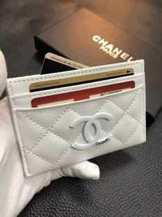 Indulge in timeless elegance with the Luxury Chanel Classic Wallet Card Holder. Merging iconic design with unparalleled craftsmanship, this exquisite accessory embodies the essence of sophistication. Crafted from the finest quality materials, each detail of this card holder reflects Chanel's legacy of luxury. The classic quilted pattern, synonymous with Chanel's signature style, adorns the exterior, lending an air of refinement to every touch. Compact yet functional, this wallet card holder seam Bags Classy, Chanel Iphone Case, Signature Quilts, Pocket Books, Branded Wallets, Spa Design, Favorite Handbags, Chanel Wallet, Quilted Pattern