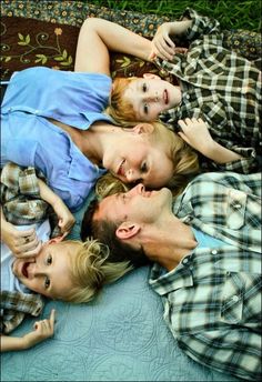 a group of people laying on top of each other