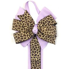 Organize your lovely hair accessories with this decorative hair clip / hair bow holder. The holder features a colorful bow at the top with a loop for you to hang on the wall or in your closet. A super-long double ribbon allows the holder to store hair clips and hair bows of various sizes. The holder can store approximately 12 large hair bows or 30 small hair clips on each ribbon. Available in various colors and designs. Dimensions: Decorative Bow: 4"L x 4"W. Ribbon 34"L x 1.5"W. Material: Ribbon Ribbon Hair Clip, Hair Accessories Holder, Decorative Hair Clips, Fashion Apron, Hair Clip Holder, Large Hair Bows, Small Hair Clips, Lace Tape, Hair Bow Holder