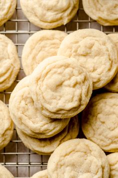 a bunch of cookies sitting on top of a cooling rack