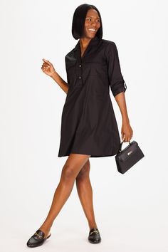 Meet the Carson Dress, your go-to fall dress. This dress features a sleek, streamlined silhouette with a buttoned front and roll-tab sleeves, perfect for transitioning from day to night. The black color and lightweight fabric make it an essential piece for any wardrobe, offering endless styling possibilities for the season. FAVORITE FEATURES: Front faux pockets ¼ button neck Roll sleeves Solid Shirt Dress With Placket For Work, Classic Shirt Dress With Roll-up Sleeves For Work, Classic Workwear Shirt Dress With Roll-up Sleeves, Casual Button-up Business Dress, Chic Black Shirt Dress With Placket, Black Button-up Business Dress, Business Shirt Dress With Button Cuffs And Collar, Fall Black Shirt Dress With Placket, Black Shirt Dress With Placket For Fall