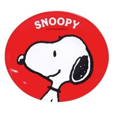 a red plate with a cartoon snoopy on it's side and the words snoopy written in white