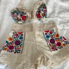 Reposhing This Item I Purchased From @Aidacoronado. Never Worn. Sold As A Size Xs And I’d Say The Shorts Do Feel Like A 0 But The Top Is More Like A C Or D Cup. The Top Was Too Big For Me (I’m 32b) Which Is Why I Never Wore This. 100% Cotton Organic Fabric According To The Designer. Check Her Out, She Has A Huge Posh Inventory With Lots Of Special Pieces. Marking As Nwt Because This Is How I Received It. Beautiful Piece For Summer, Festivals, Beach, Etc. Questions? Leave A Comment Below! Cotton Beach Sets With Floral Embroidery, Beach Sets With Floral Embroidery In Cotton, Bohemian Short Length Swimwear For Beach Season, White Floral Embroidery Sets For Vacation, Summer Beachwear Sets With Short Length, Beach Sets For Summer With Short Length, Bohemian Short Length Swimwear For Vacation, Beach Summer Sets In Short Length, Beach Embroidered Cotton Set