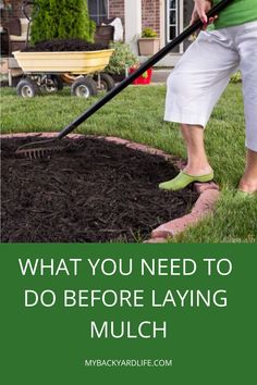 a woman using a lawn mower to mulch the grass in front of her house